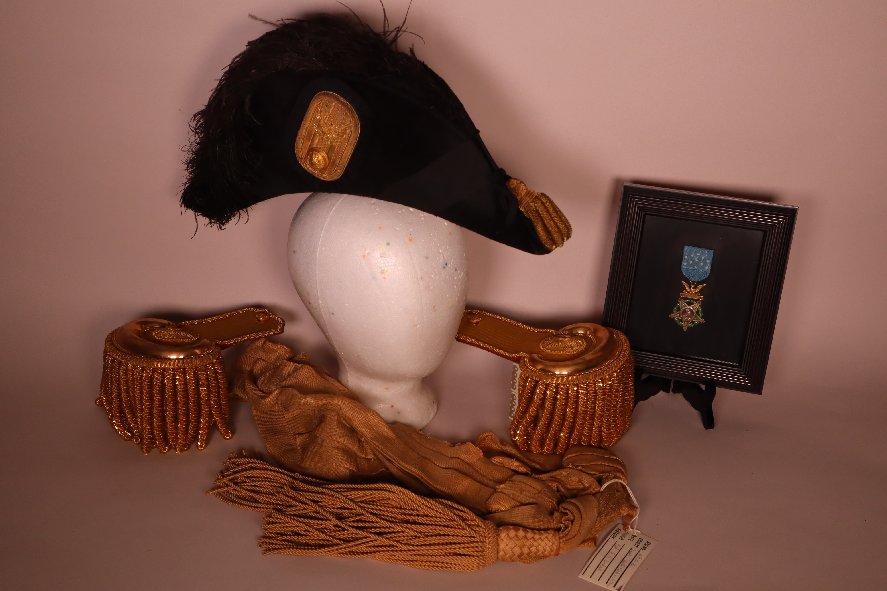 F. Dodge bicorn hat, epaulets, sash, medal